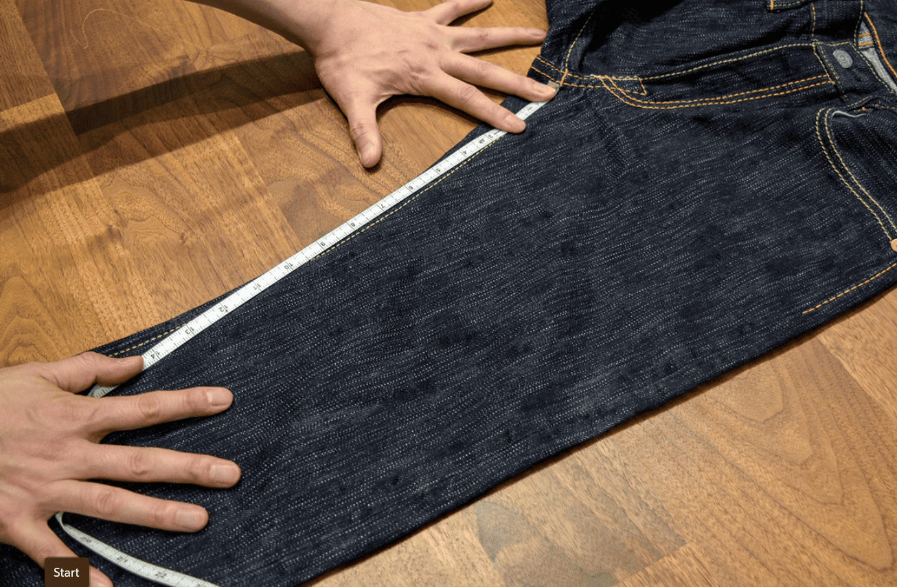lay the jeans on flat surface