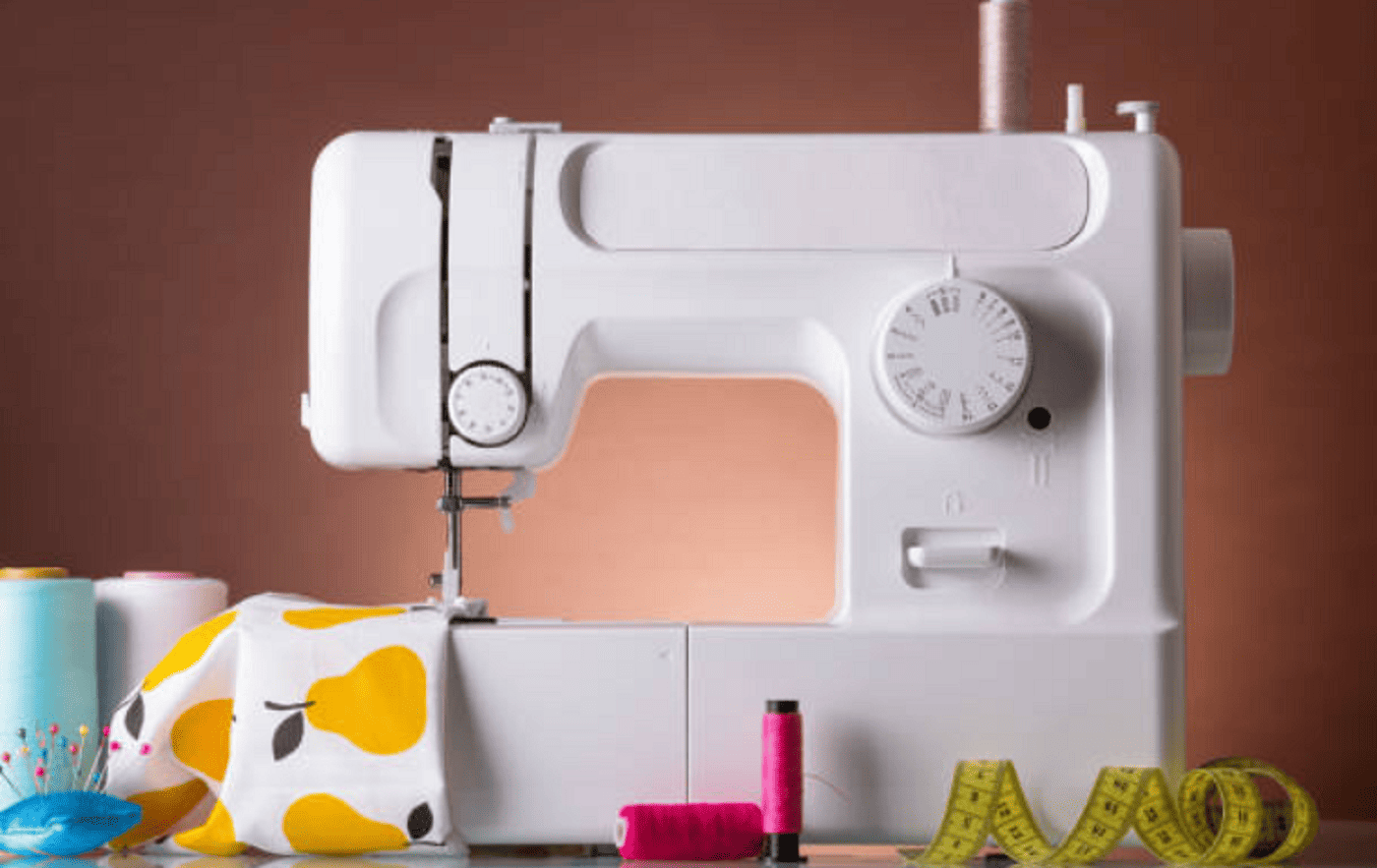 white sewing machine with accessories